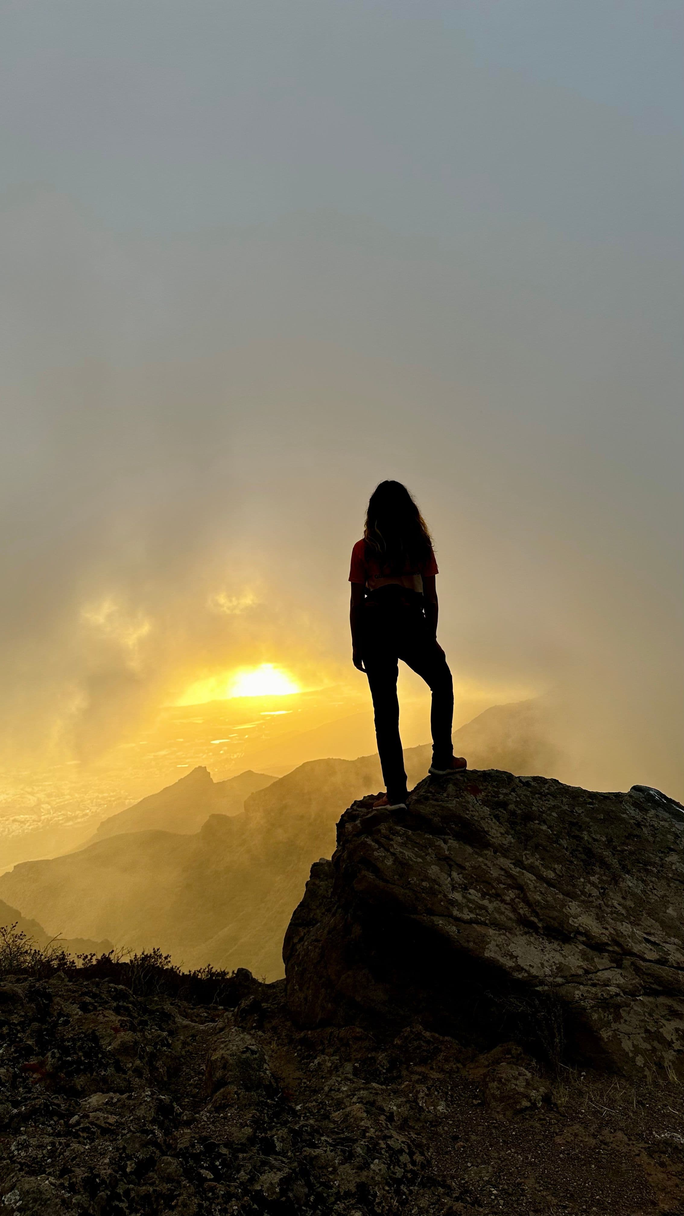 Julia at sunset above the clouds